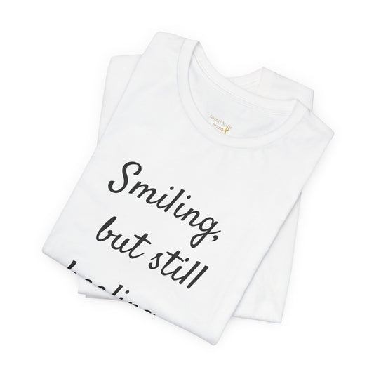 Healing Message Unisex Tee - "Smiling, but still healing"
